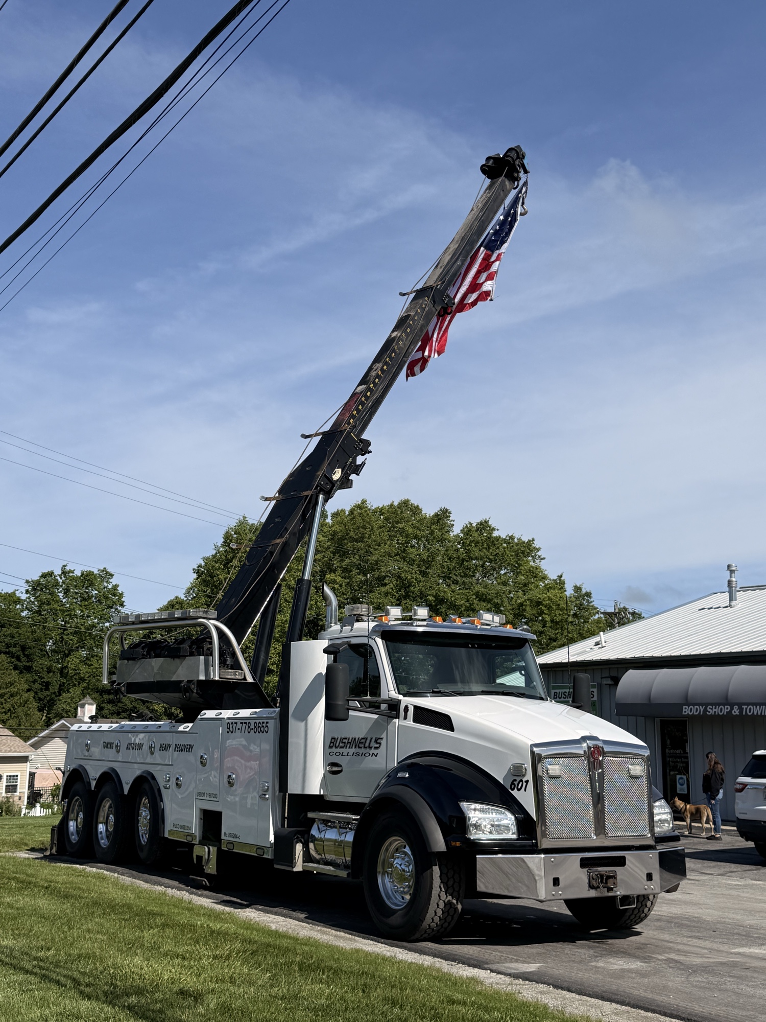 Bushnell's tow truck transporting a shuttle bus