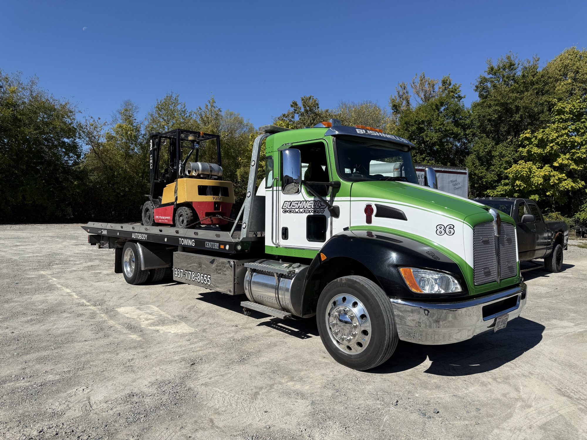 Bushnell's heavy recovery truck handling industrial steel coil transport