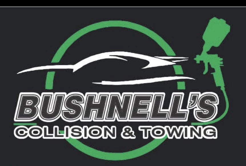 Bushnell's flatbed tow truck carrying a work truck