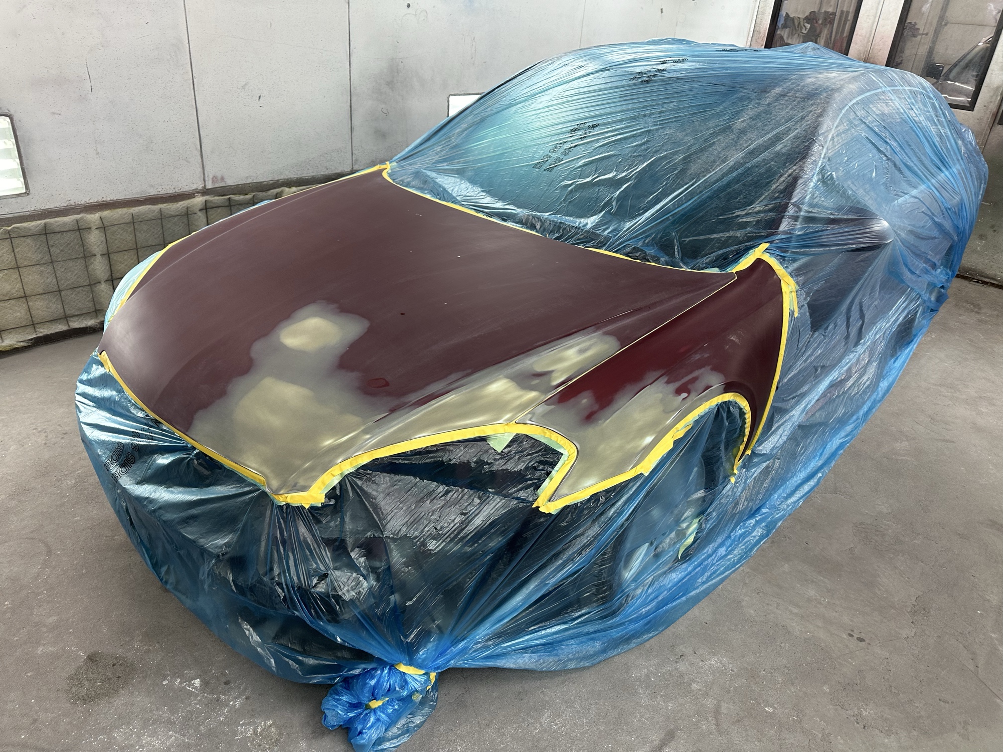 Freshly painted red body panel with glossy finish