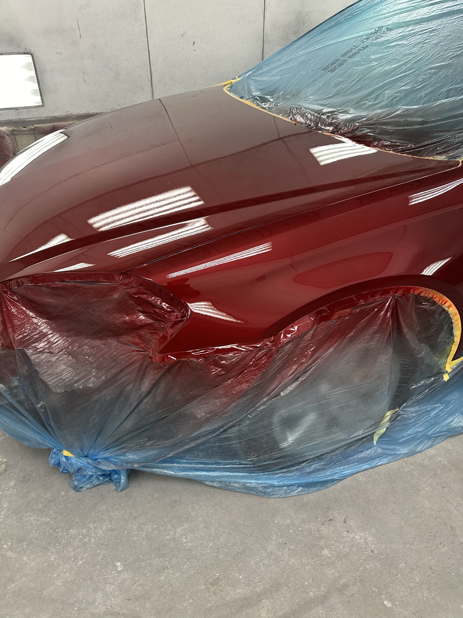 Vehicle hood and fender in body shop prep stage